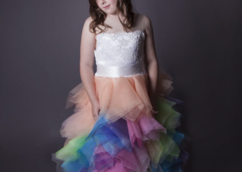daughter looking at pretty dress with coloured tulle