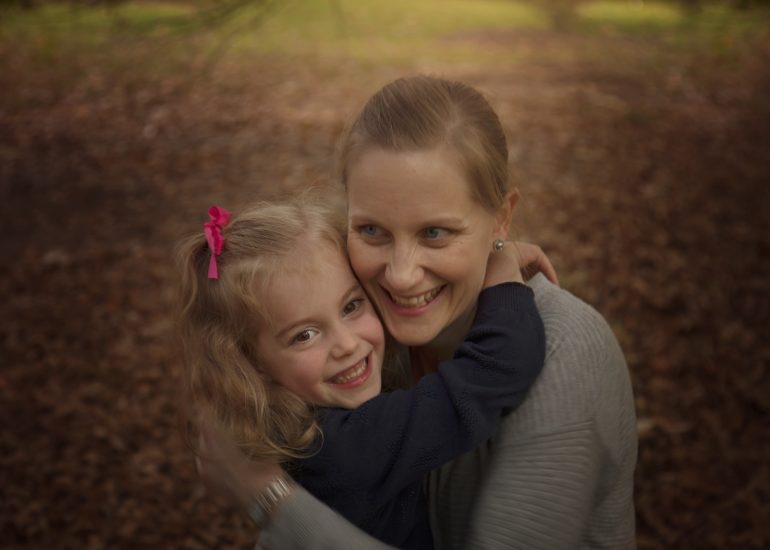 mom and daughter smiling at autumn mini sessions