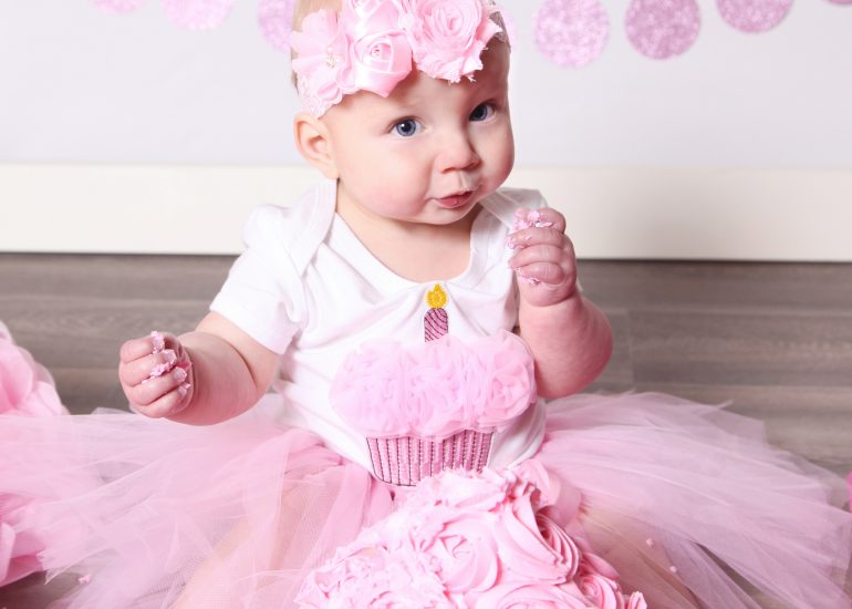 girl in pink tutu with a giant pink cupcake