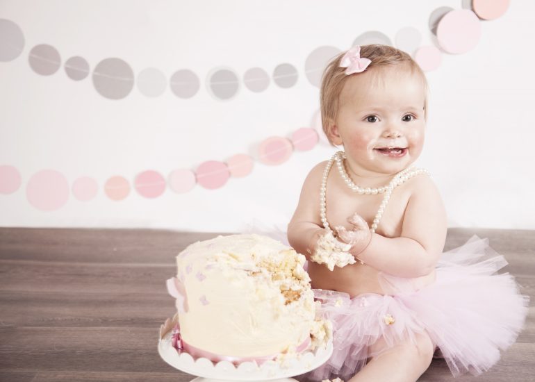 Girl with pearls for first birthday cake smash