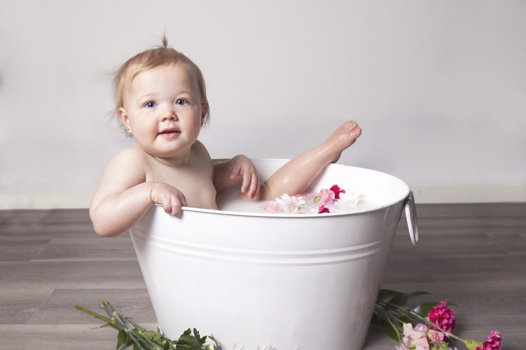 Girl in Milk Bath Tub with Pink Flowers