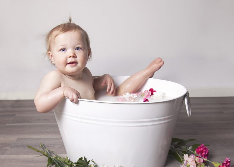 Girl in Milk Bath Tub with Pink Flowers